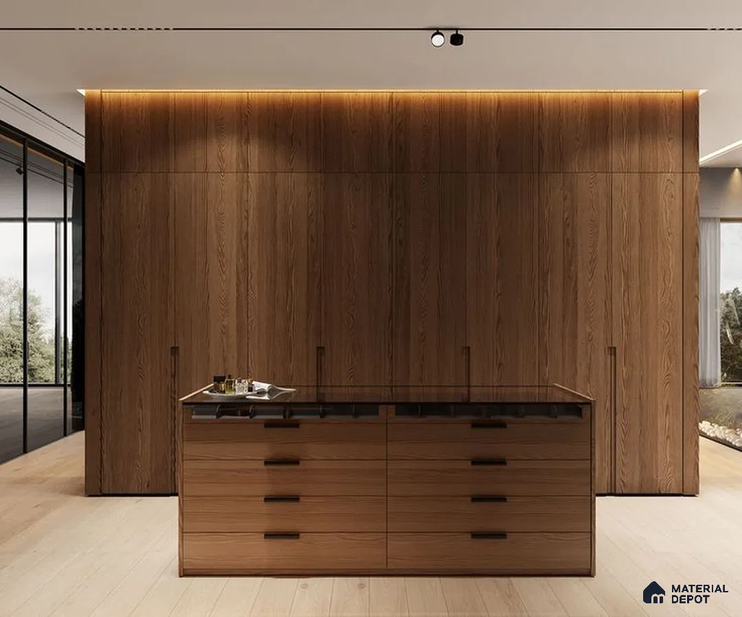 A kitchen with marble counter tops and stainless steel appliances on the wall, along with hanging lights hanging from the ceiling over the ceiling in front of a wooden counter top of a white counter top oven and white